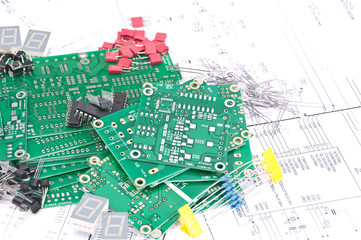 Circuit boards and components with schematics in background