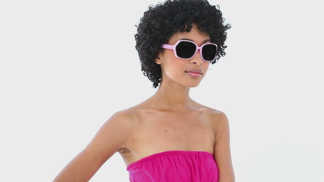 Woman in pink wearing sunglasses
