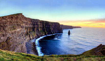 Panoramic view of Cliffs of Moher at sunset in Ireland.