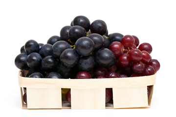 red and blue grapes in a basket