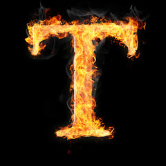 Fonts and symbols in fire on black background - T