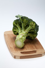 brocolli on the cutting board on the white background