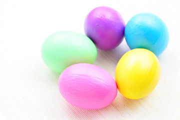 Fototapeta na wymiar children paint colorful easter eggs