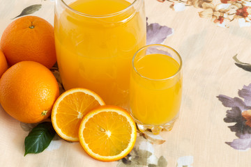 glass of Orange juice and oranges