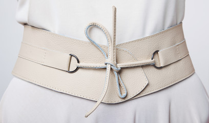 Fashion. Women's beige leather wide belt with lacing