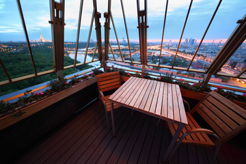 Wooden chairs and table at terrace in restaurant