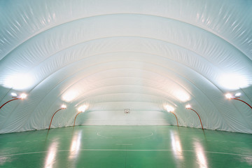 Naklejka premium People train in indoor sports ground