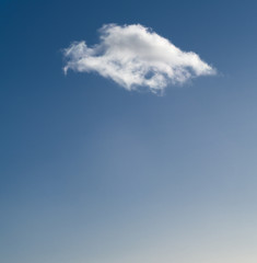 Single cloud on blue sky