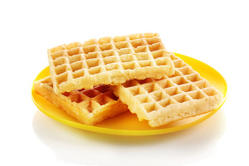 Sweet waffles on plate isolated on white
