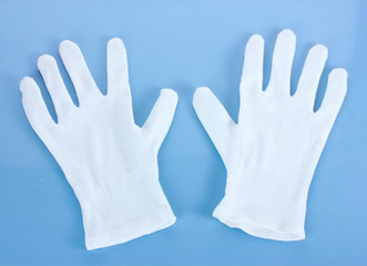 cloth gloves on blue background.
