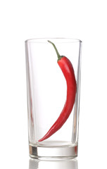 Red hot chili pepper in glass isolated on white