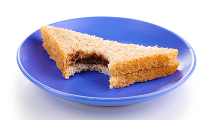 Bitten sandwich with chocolate on plate isolated on white