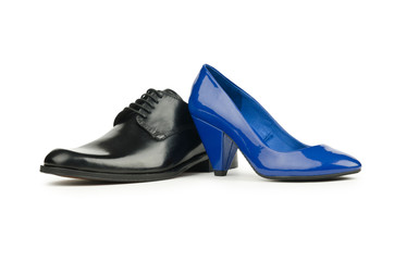 Male and female shoes on white