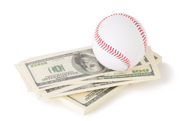 Baseball on top of stacks of cash, white background