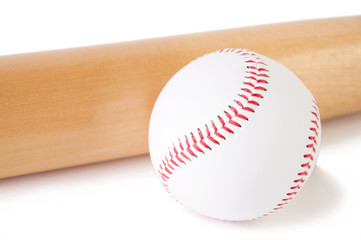 Close-up of baseball bat and ball, isolated over white