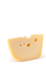 Piece of Maasdam cheese isolated over white