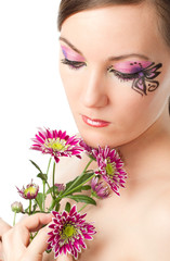 portrait of woman with body art butterfly on face