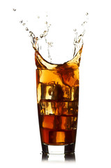 Ice cube droped in cola glass