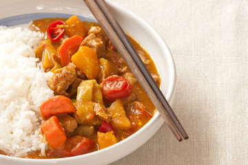 Delicious pork curry served with hot Thai jasmine rice