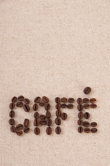 Roasted coffee beans forming the word cafe