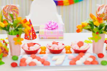 Obraz na płótnie Canvas Closeup on table decorated for baby birthday party