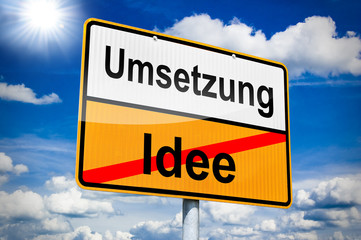 Ortseingangsschild mit Umsetzung und Idee