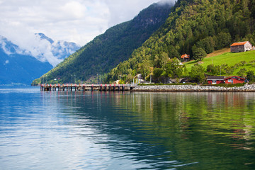 Fototapeta na wymiar Moorage on fjord shore