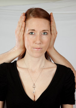 woman with hands over her ears