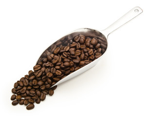 Coffee beans on a scoop isolated on white