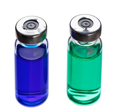 Blue and green medical ampoules isolated on a white