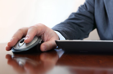 Closeup of  business man's hand  working on computer