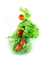 Light lettuce and tomatoes flying salad concept