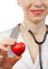 Woman doctor with stethoscope and heart