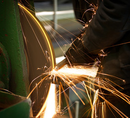 Emery in process in machinery workshop
