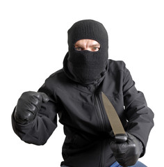 Masked criminal holding a knife, isolated on white
