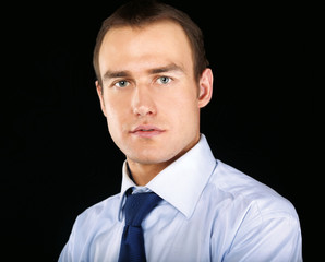 A portrait of a businessman  isolated on black background