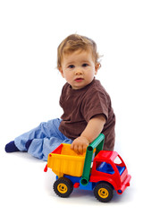 Fototapeta premium Cute little boy with car
