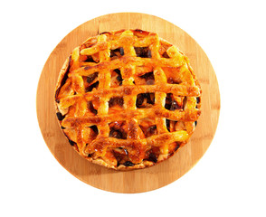 Delicious home baked apple pie on wooden cutting board
