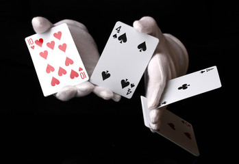 Obraz premium Cards in hands isolated on black