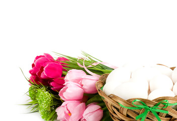 Basket with Easter eggs and spring tulips