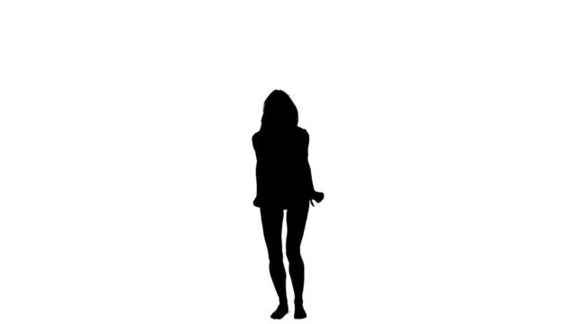 Silhouette of a jumping woman in slow motion