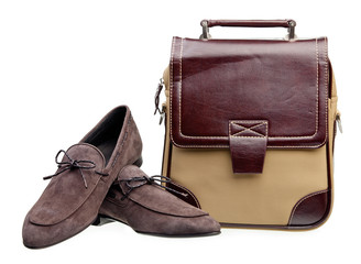 Naklejka premium Pair of brown men loafers and messenger bag over white