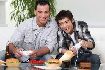 Father and son playing video game