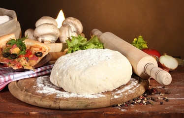 delicious pizza dough, spices and vegetables