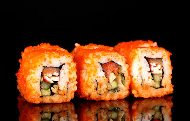 delicious sushi on black background