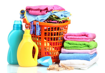 Clothes with detergent and washing powder in orange plastic