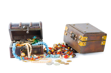 Two chest with around them jewels on a white background