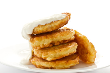 fried fritters on a white plate