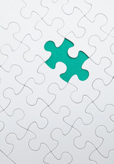 Fototapeta premium puzzle with green piece missed