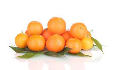 Ripe tasty tangerines with leaves isolated on white